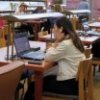 Students studying in the library, using laptop computers. Image by Bonnie Henderson from Pixabay.